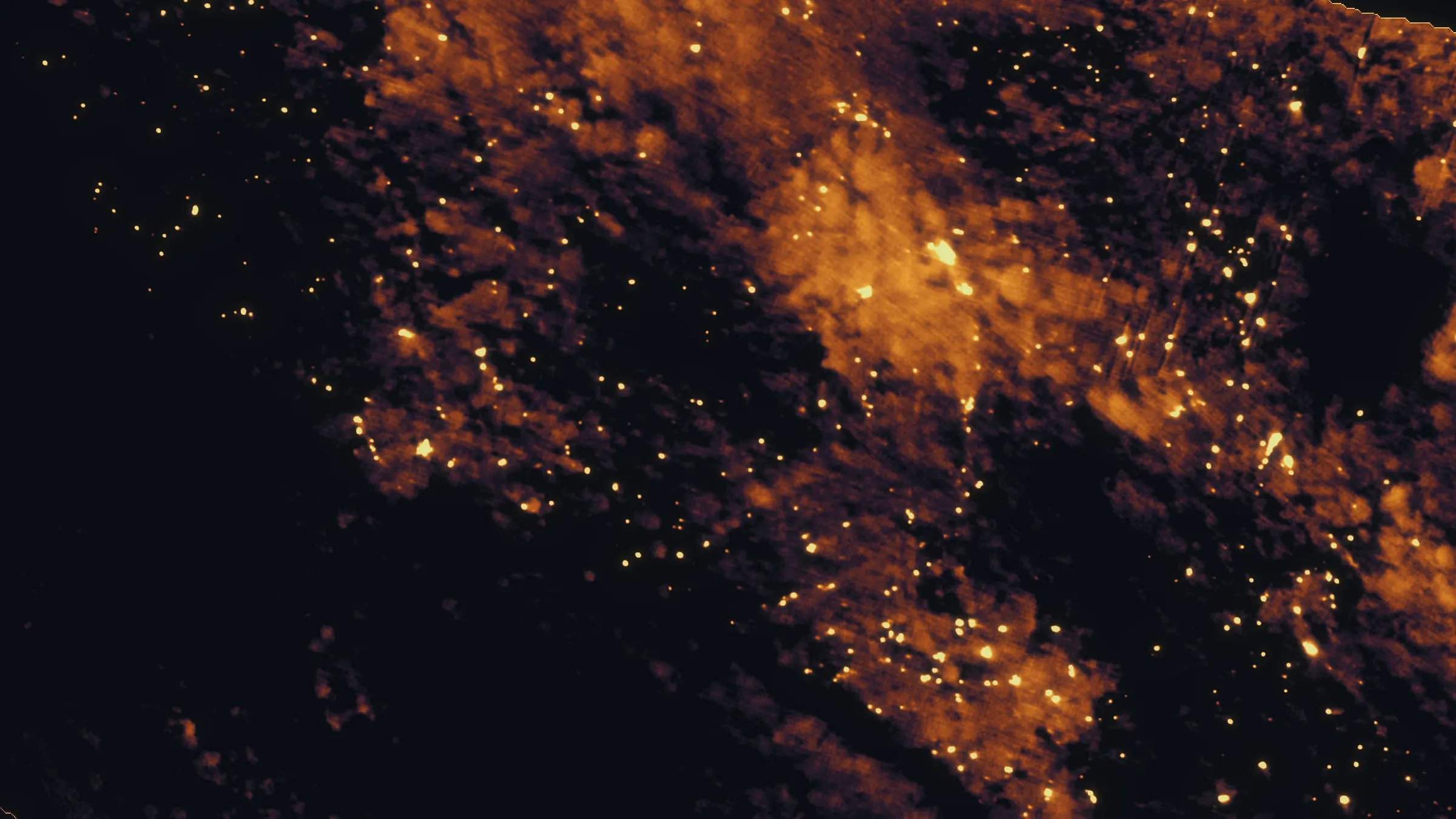 Night thermal map of the East Evans Creek fire, scattered heat sources glowing across burned ground.