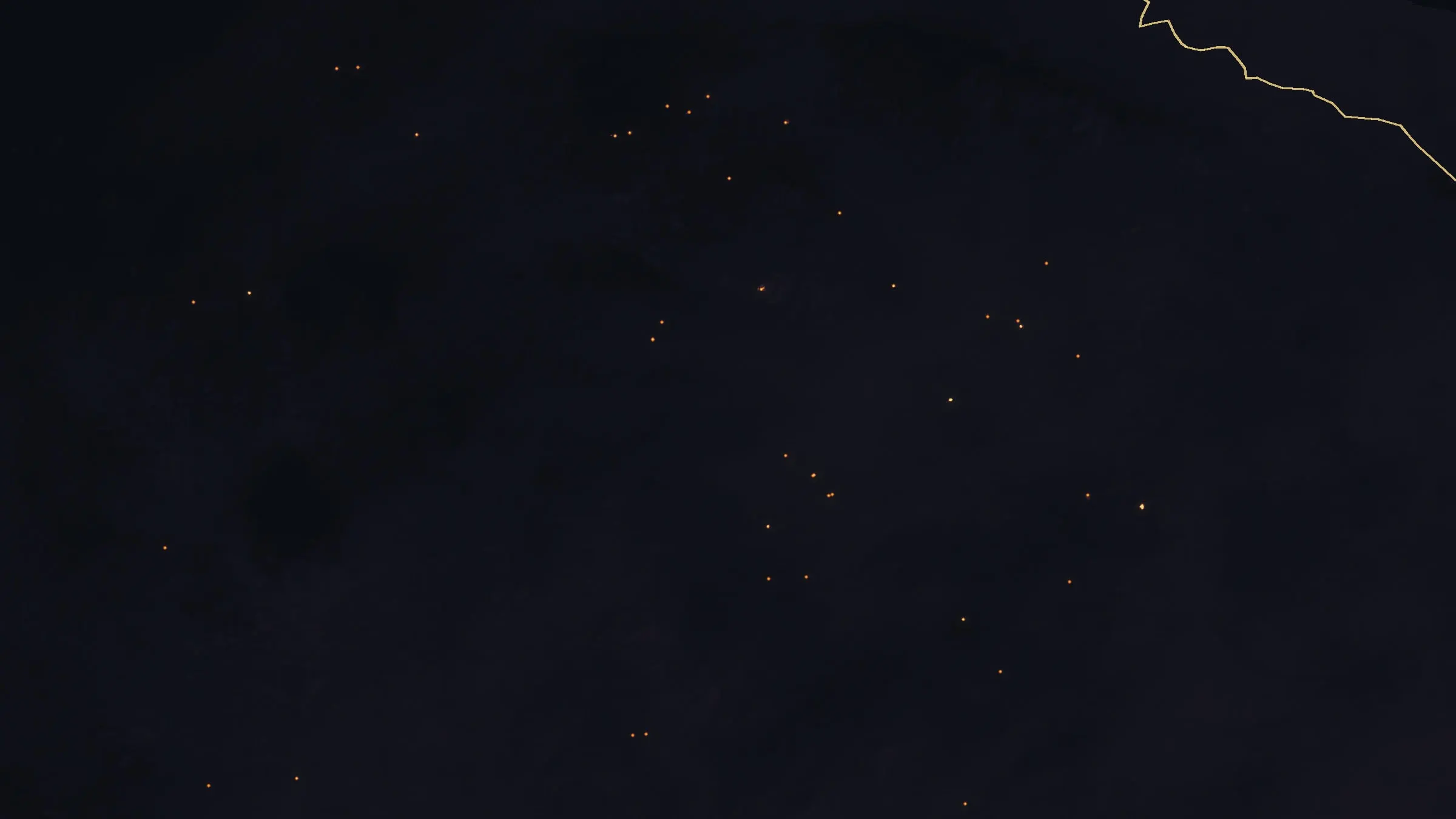 The same ground on the last night: dark burned slopes with a few dozen small heat sources left.