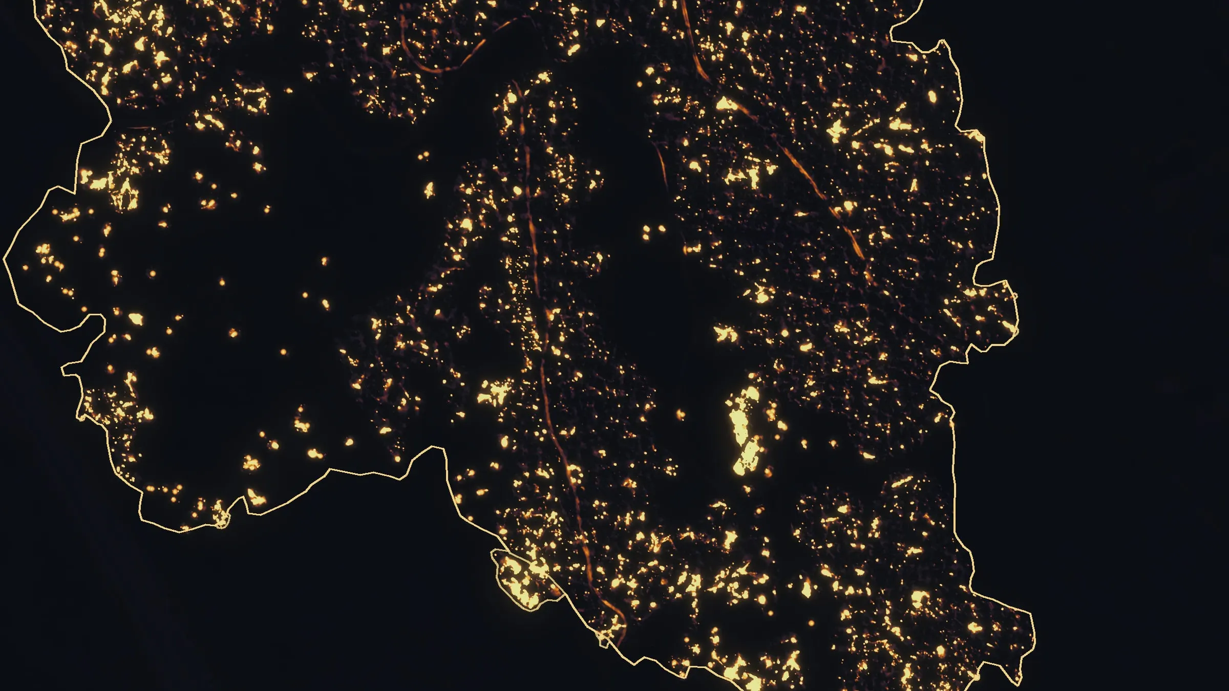 Night infrared of the Interstate 5 fire before dawn on its first night, heat sources and patches of heat glowing inside the outlined perimeter.
