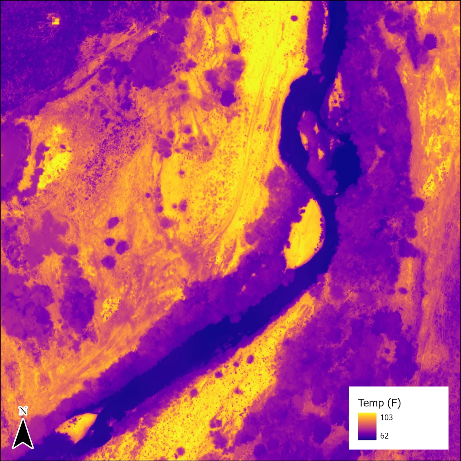 Afternoon thermal mosaic, the river channel dark and cool against warm ground.
