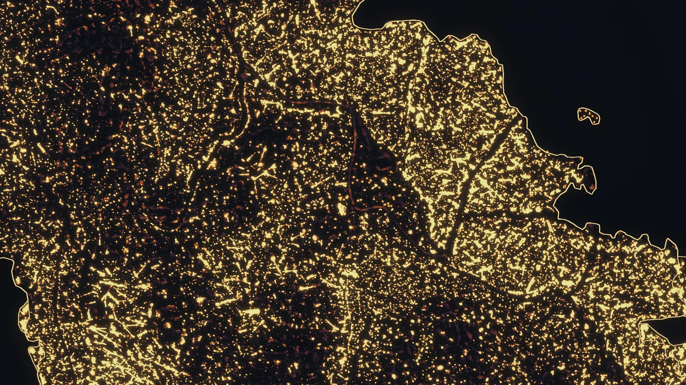 Night infrared of the Woodrat Mountain fire on its first night, heat glowing across most of the burn inside the outlined perimeter.